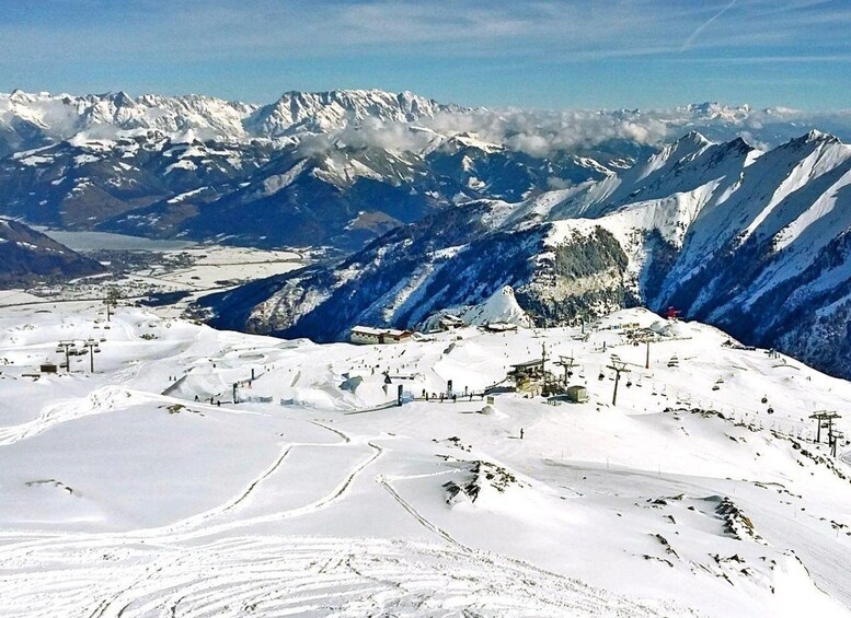 A snow-covered mountain landscape with ski slopes and a ski lift. 1