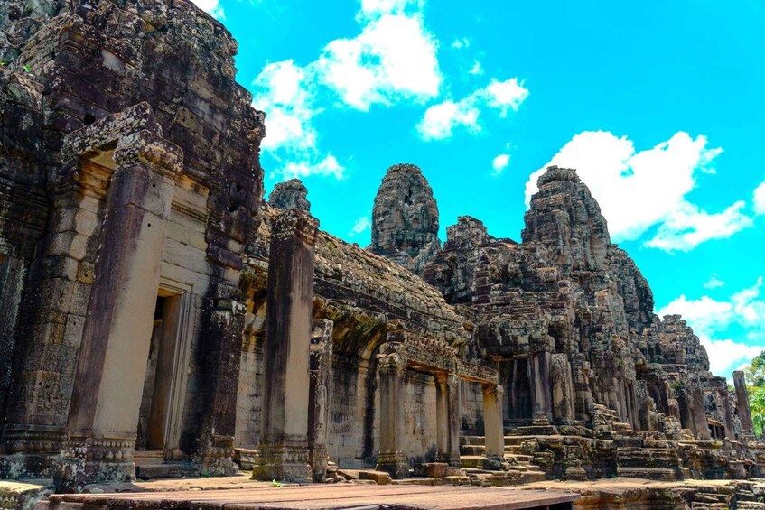 Ancient stone structures with columns and a clear blue sky. 3