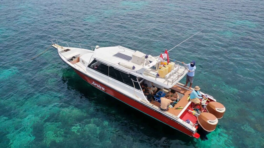 A boat named 'Arsiva' on clear turquoise water. 2
