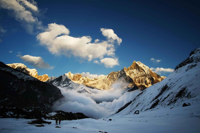 A snow-covered mountain landscape with a clear sky and a prominent peak. 3