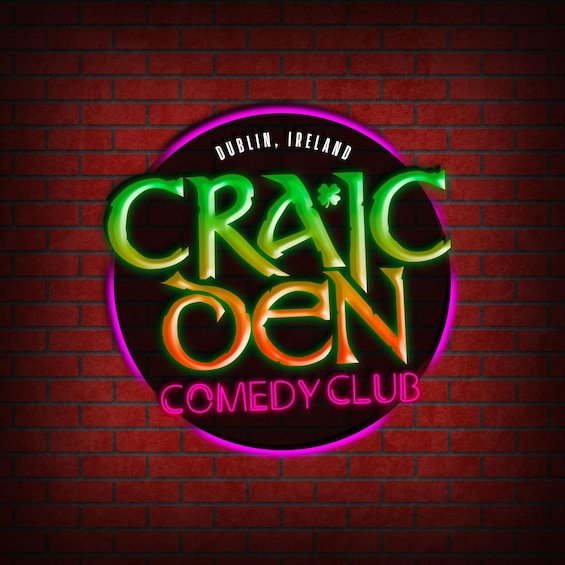 A neon sign for 'CRAIG OEN COMEDY CLUB' on a brick wall. 1
