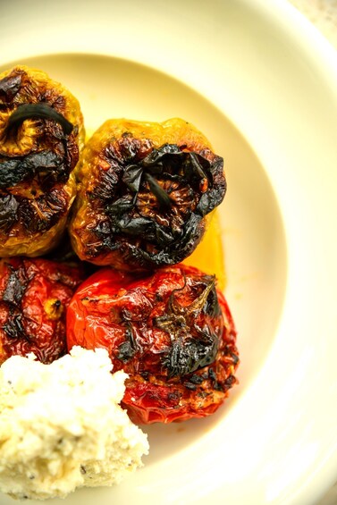 Roasted peppers and a dollop of cream on a plate. 2
