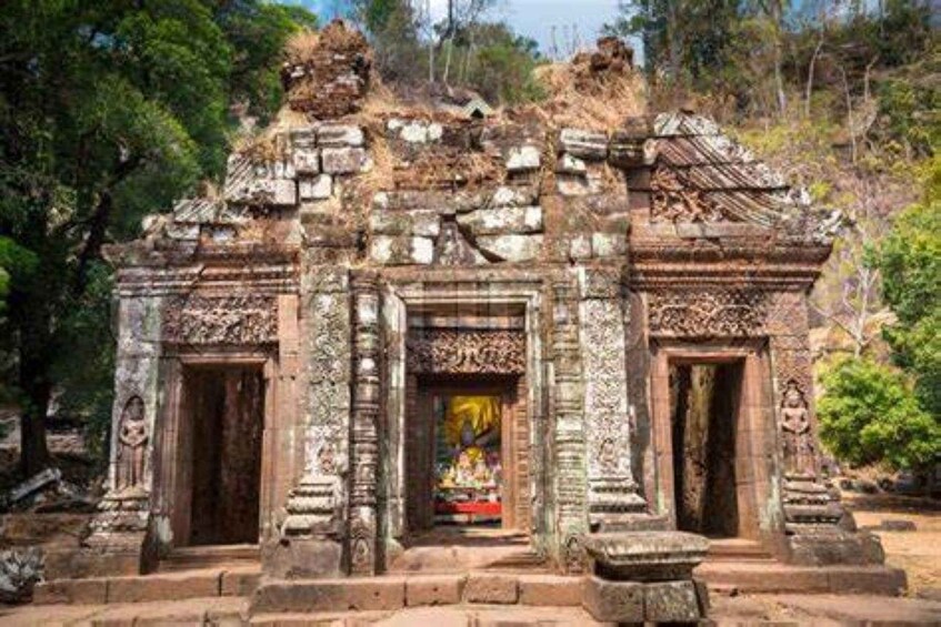 An ancient temple with intricate carvings and a central doorway. 4