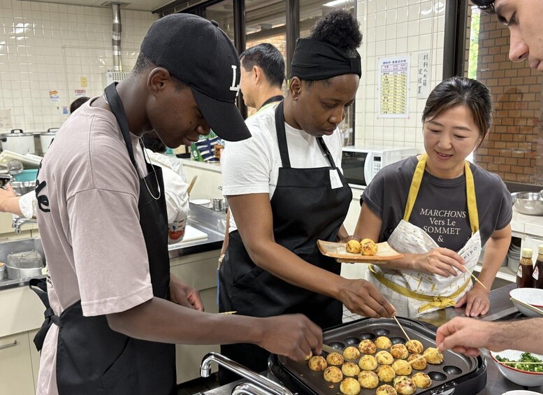 People preparing food in a kitchen. 5