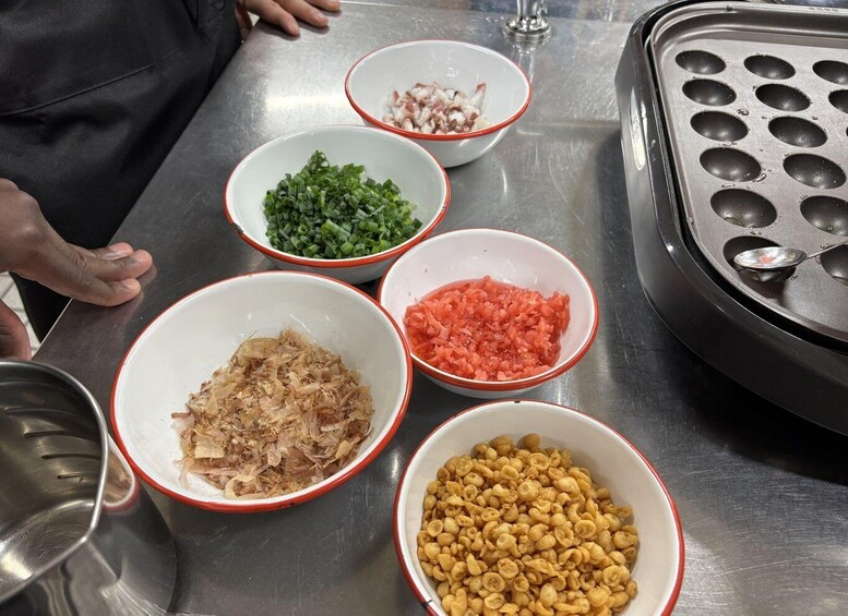 Bowls of various ingredients on a stainless steel table. 3