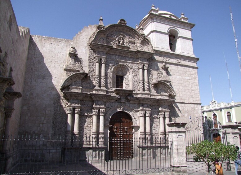 A historic church with intricate carvings and a prominent bell tower. 4