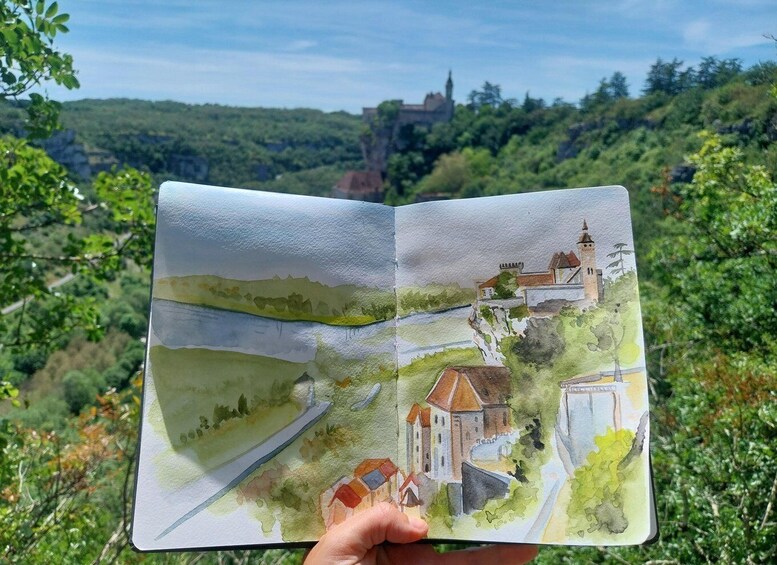 A watercolor sketchbook with a drawing of a castle on a hill, surrounded by greenery. 1