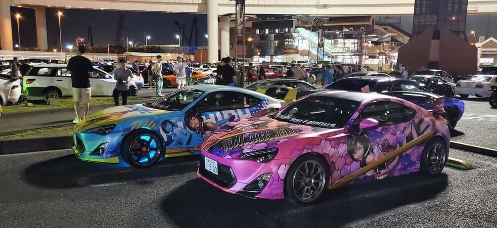 A car show with custom-painted sports cars. 1