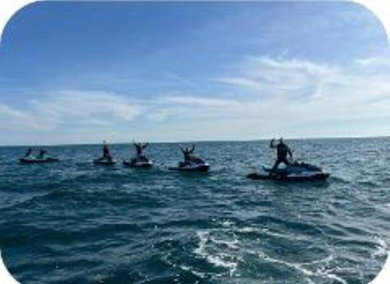 A group of jet skis on the ocean. 1