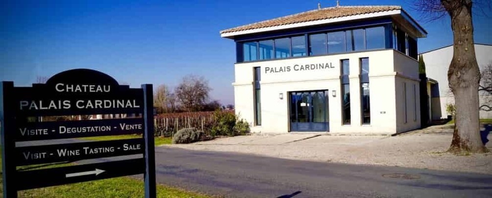 Chateau Palais Cardinal with a sign indicating visit, degustation, and sale options. 2