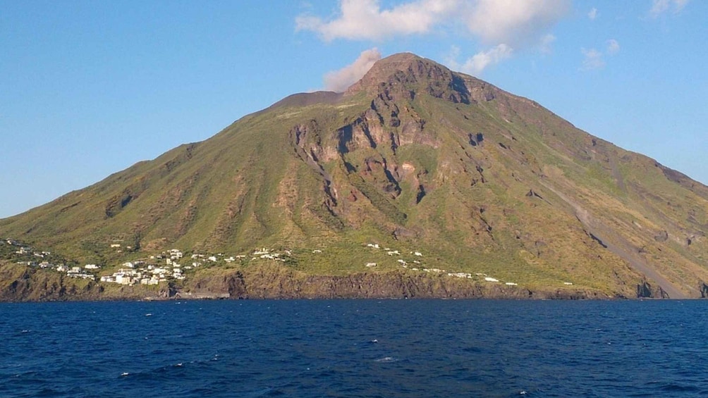 A mountain with a small settlement at its base. 3