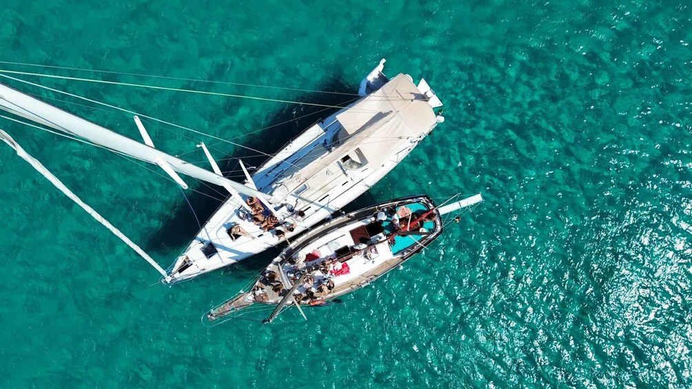 Two sailboats on turquoise water. 1