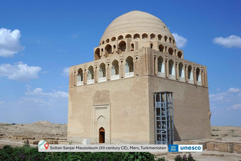 The Soltan Sanjar Mausoleum, a 12th-century CE structure in Merv, Turkmenistan, featuring a large dome and arched windows. 4