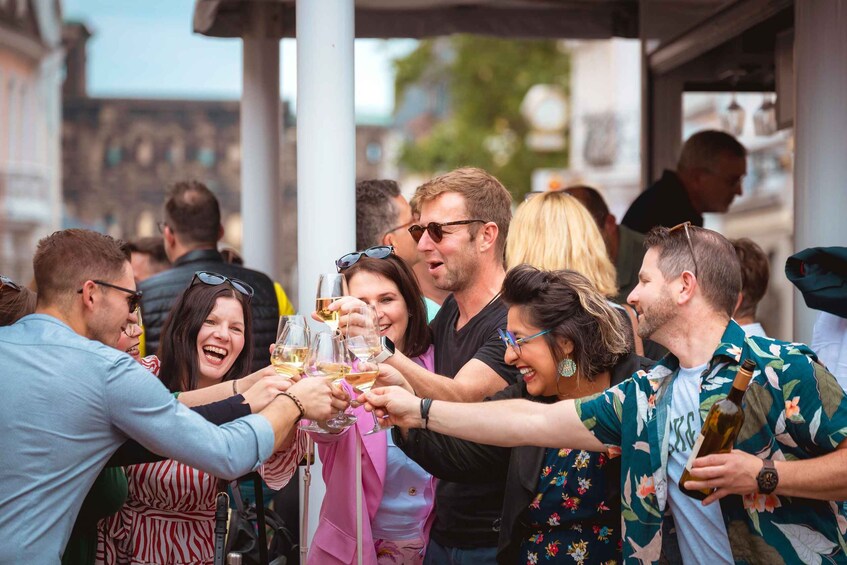 A group of people toasting with wine glasses. 2