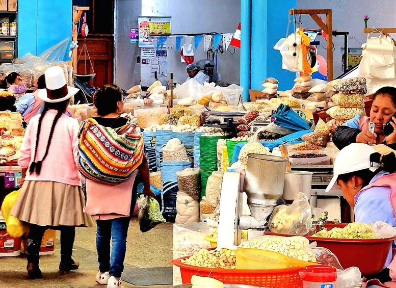 A bustling market with people shopping and vendors selling various goods. 5