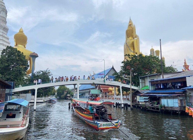 A river with boats, a bridge, and golden statues. 5