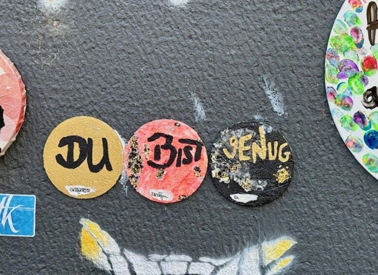 Stickers with text on a textured surface. 3