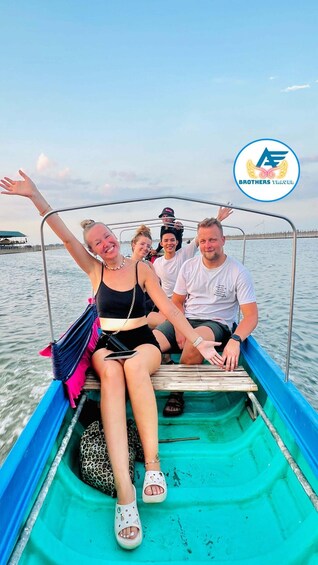 A group of people on a boat with a logo of 'Brothers Travel' in the corner. 2