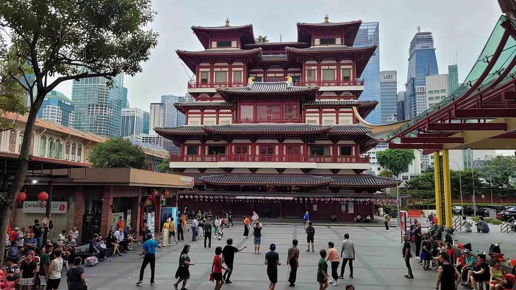 A traditional multi-tiered building with a modern cityscape in the background. 3
