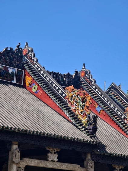 A traditional building with ornate roof decorations and intricate carvings. 3