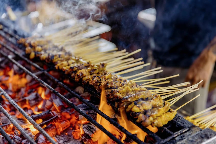 Skewers of grilled meat over an open flame. 4