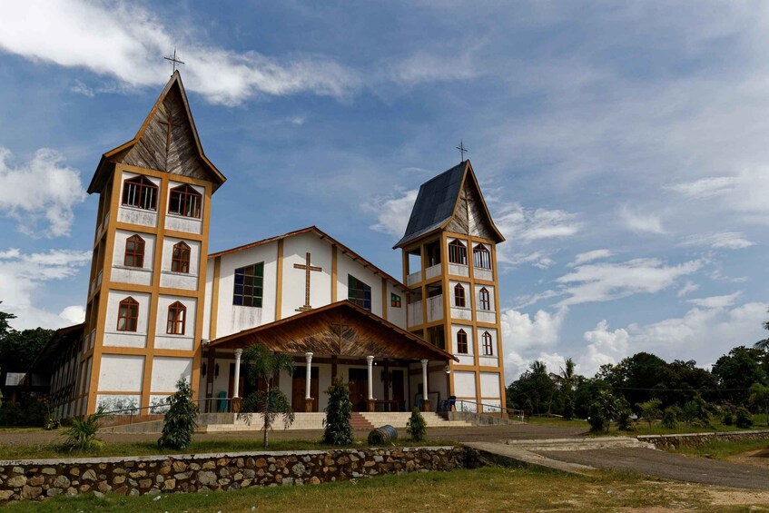 A church with two towers and a central building. 1
