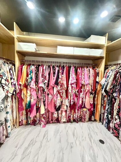 A clothing store with a variety of colorful garments on display. 4