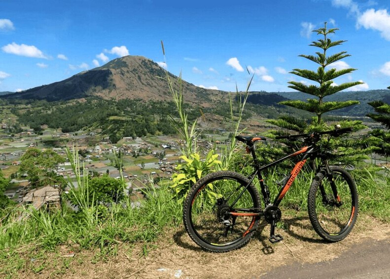 A mountain, a bicycle, and a rural landscape. 1