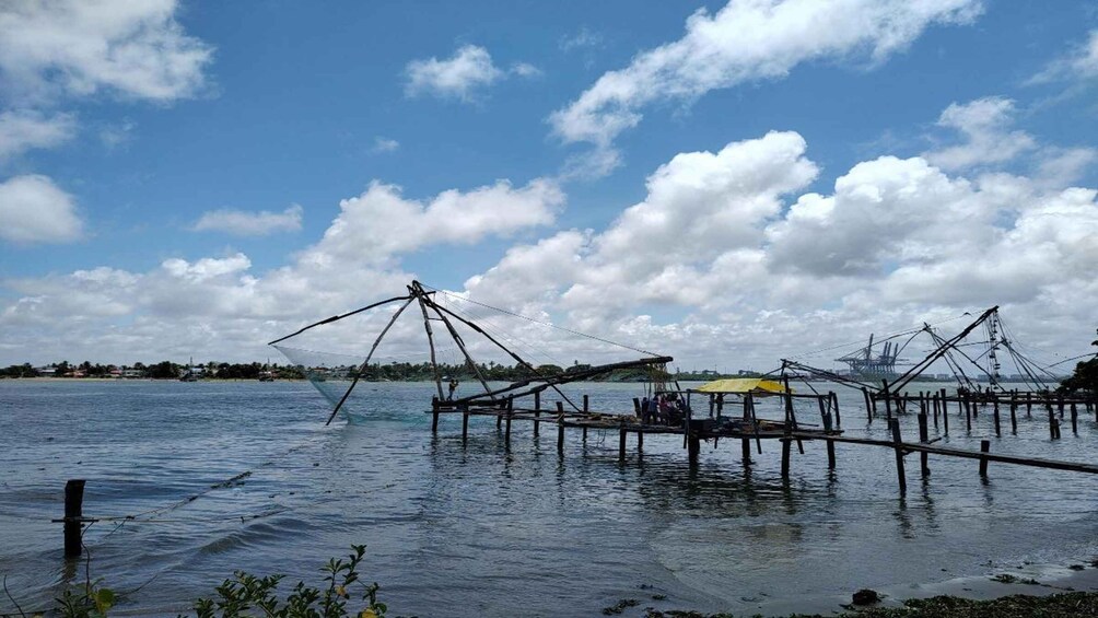 A coastal fishing area with multiple fishing nets and wooden structures. 5
