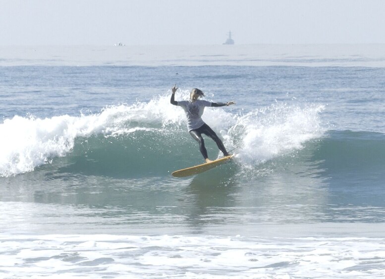 A person surfing a wave in the ocean. 5