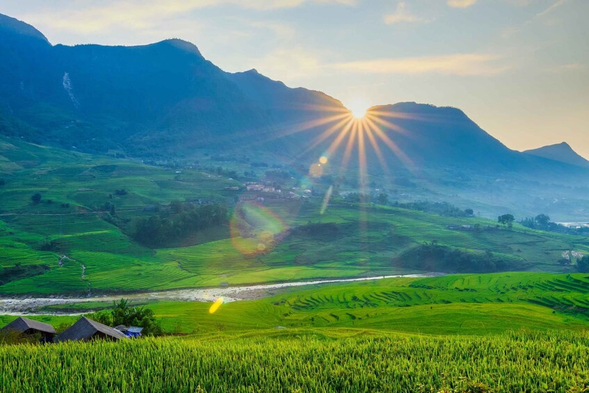 A mountainous landscape with terraced fields and a river. 3