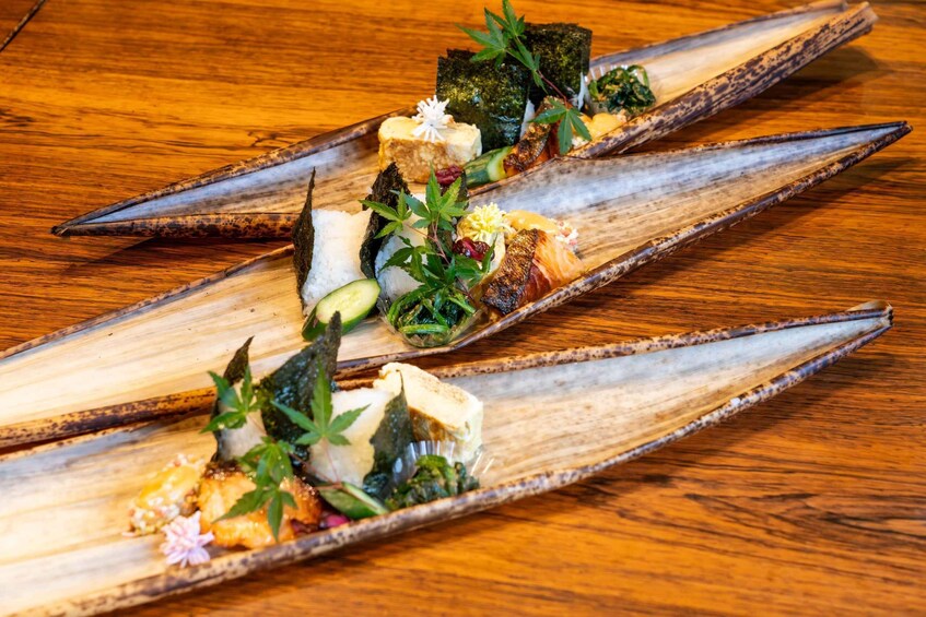 A wooden boat with food arranged on it. 2