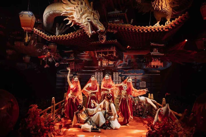 A traditional Chinese opera performance with performers in elaborate costumes, a dragon, and ornate architecture. 1
