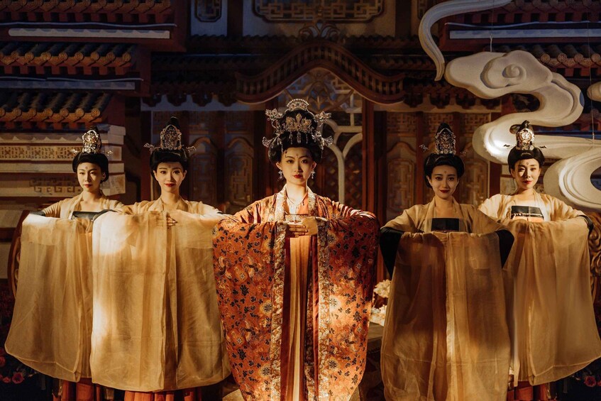 A traditional Chinese palace interior with ornate architecture and individuals in historical attire. 4
