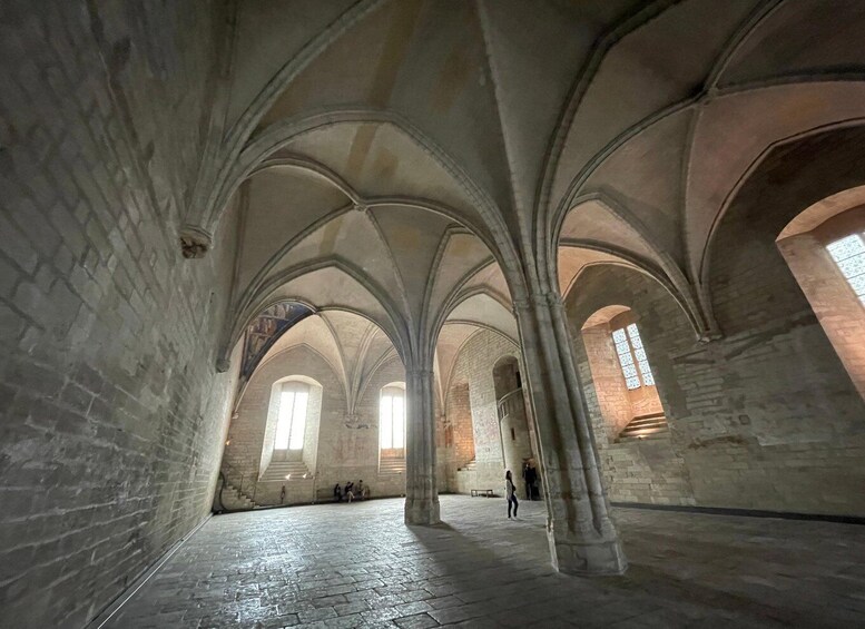 A cathedral interior with high vaulted ceilings and stone walls. 4