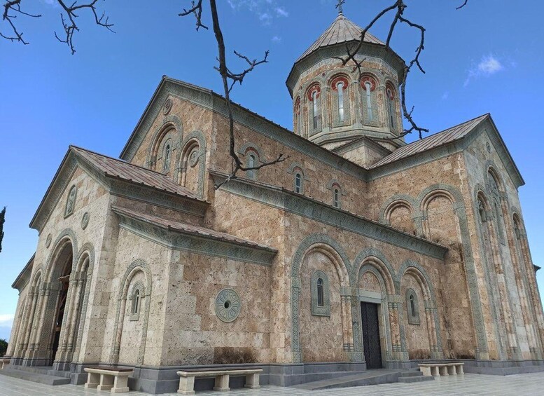 A large, historic church with a prominent dome and arched windows. 5