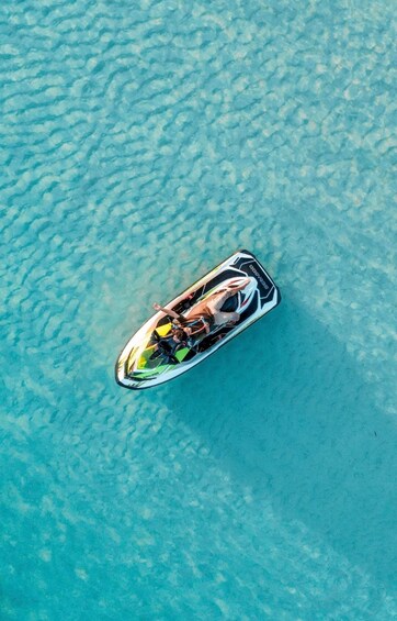 A jet ski on clear turquoise water. 5