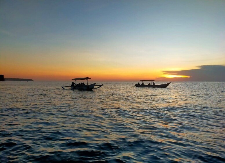 Two boats on calm water during sunset. 4