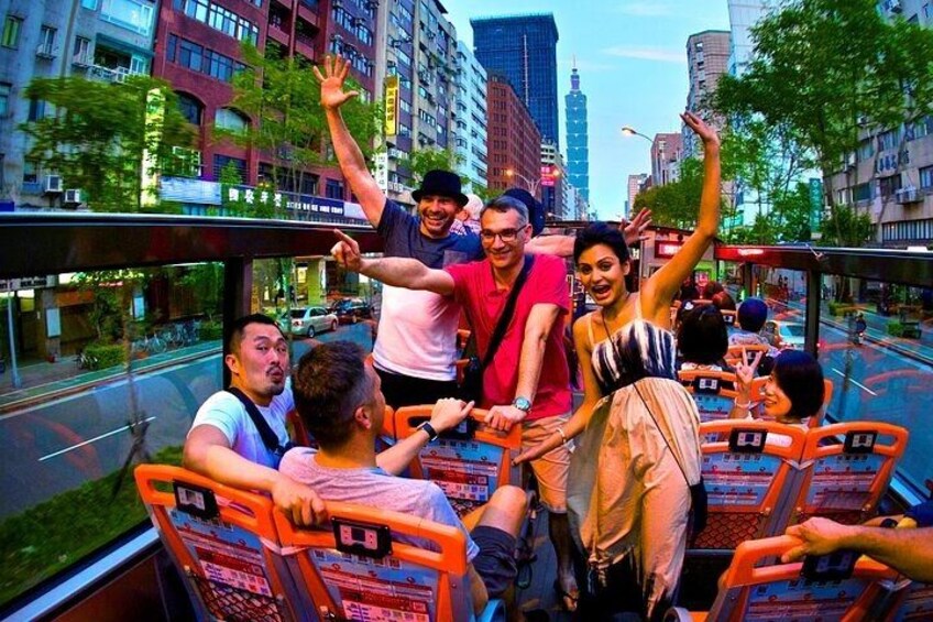 A group of people on a moving walkway with a cityscape in the background. 3