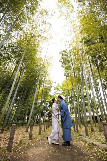A couple kissing in a bamboo forest. 3