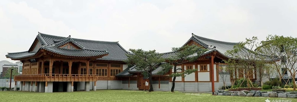 A traditional Korean building with wooden structures and tiled roofs. 4