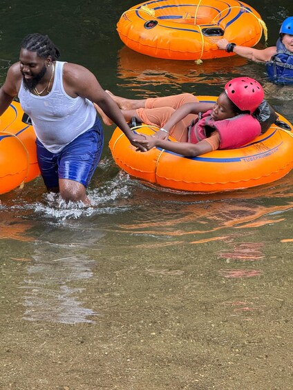 People in inflatable tubes on water. 2