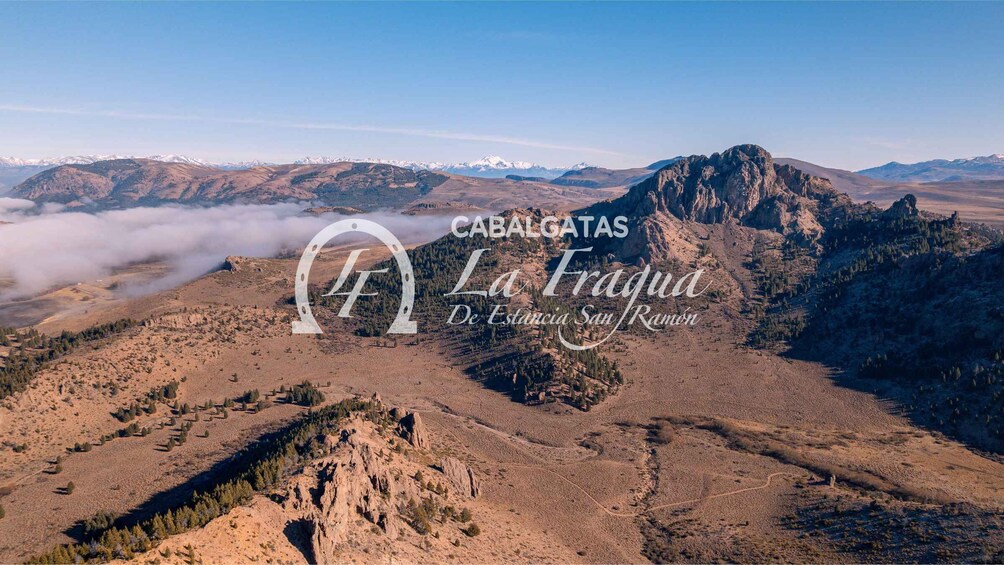A rugged mountain landscape with a clear sky. 1