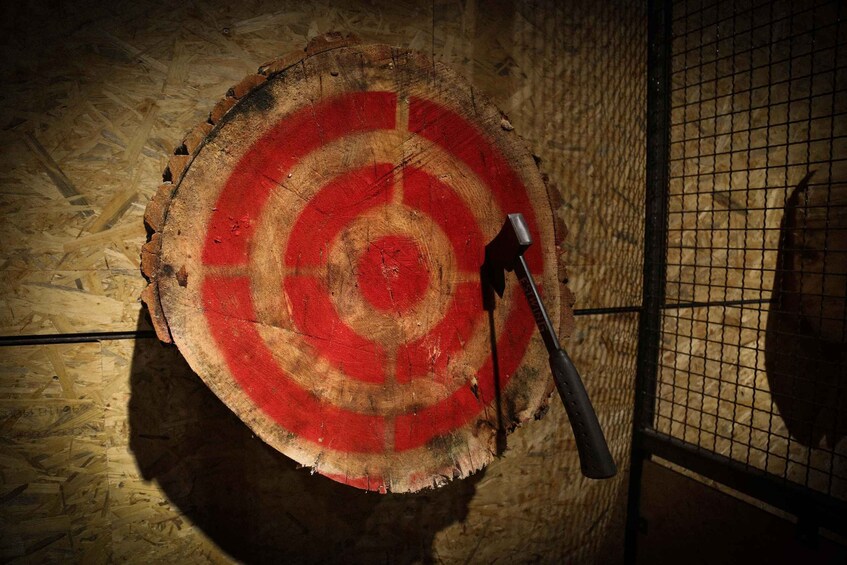A wooden target with a hammer. 3