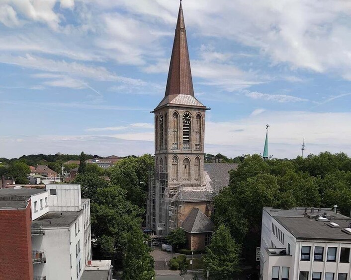 A church with a tall steeple and a clock tower. 5