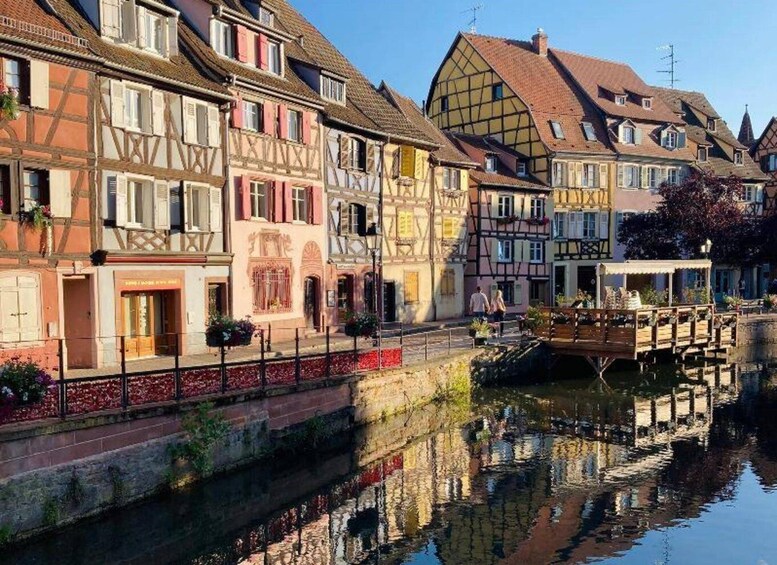 A canal with traditional half-timbered houses reflecting in the water. 2