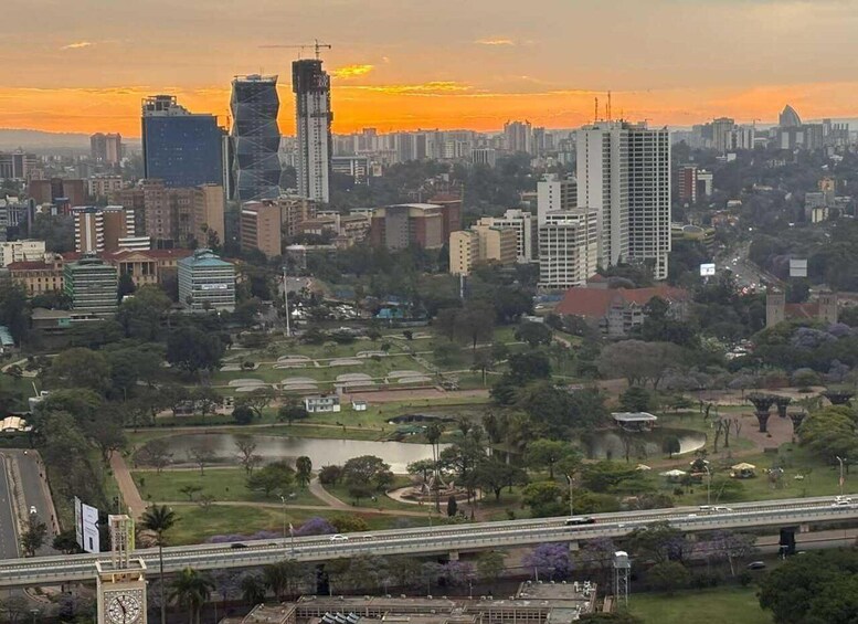 A cityscape with a river, green spaces, and a bridge. 3