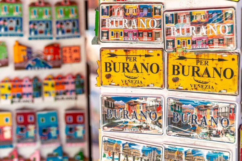 A collection of travel postcards with the word 'BURANO' and 'VENEZIA' printed on them. 2
