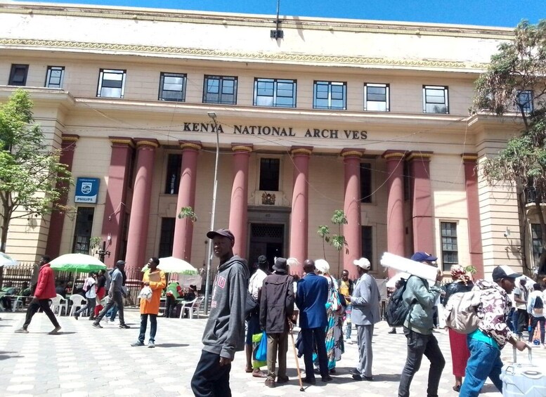 The Kenya National Archives building with columns and a signboard. 2