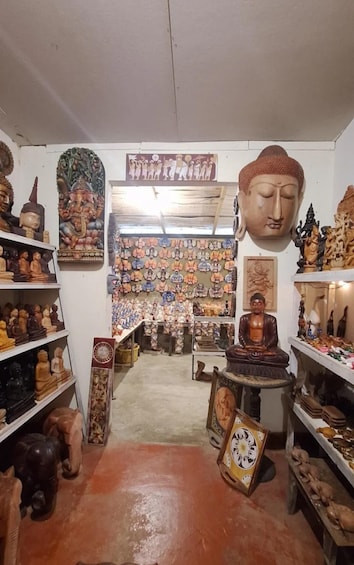 A shop with various statues and religious figures on display. 4
